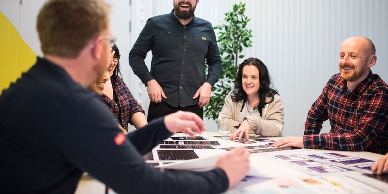 The Chick team around a table in the Colchester office